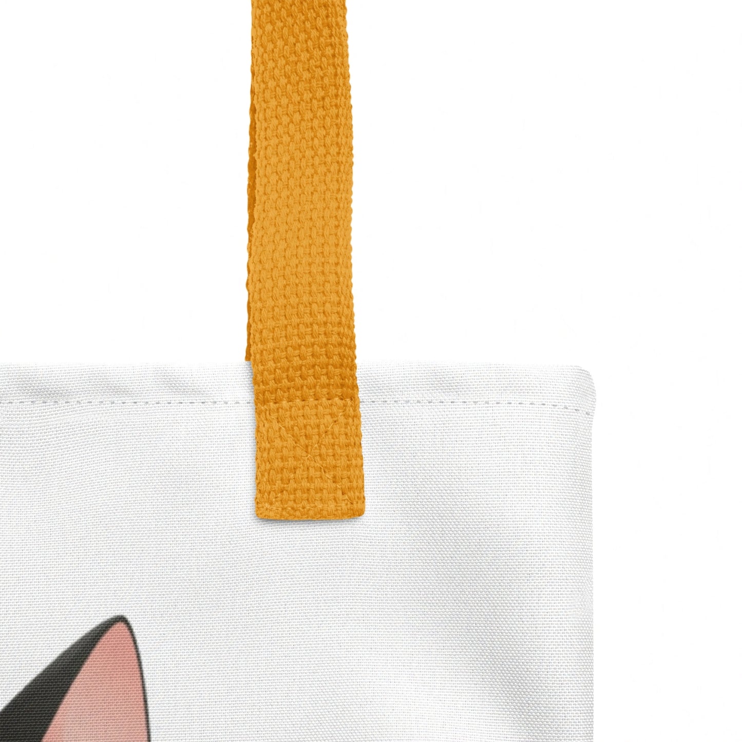 Detailed close-up of Alfred tote bag strap stitching and top edge, cat design visible on a white background