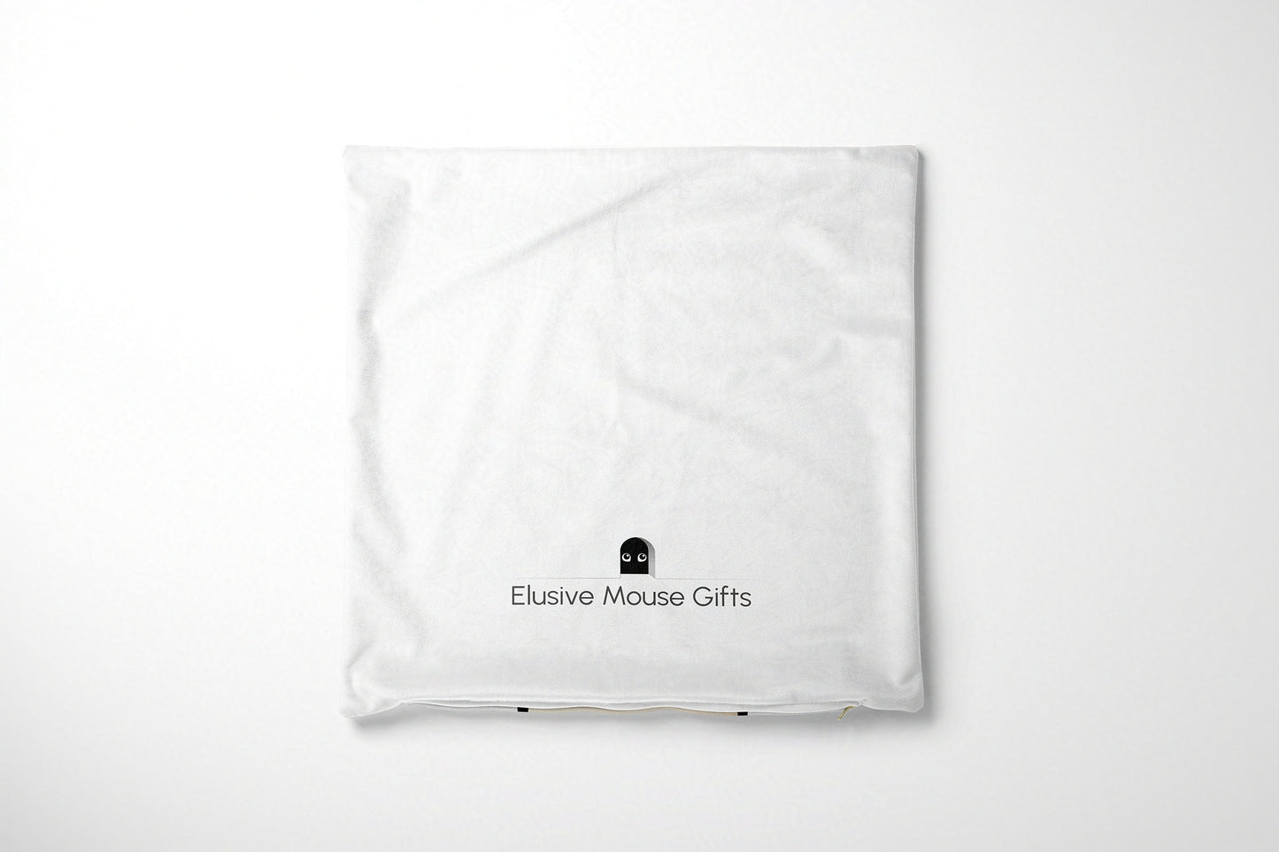 White cushion cover with 'Elusive Mouse Gifts' logo on a white background