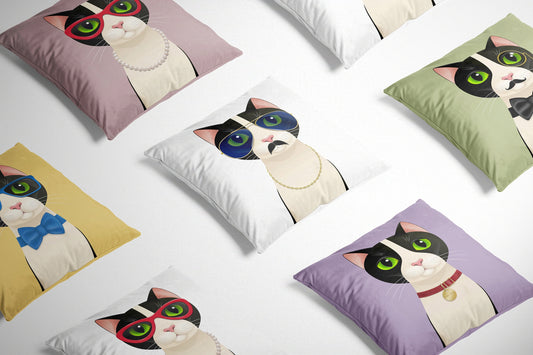 Freddie Cat White Cushion on a white background surrounded by other cat design cushions