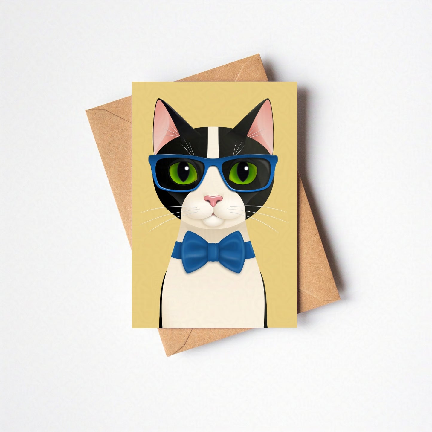 Overhead view of Mr Cat greeting card and envelope laid flat, featuring the cat against a yellow-coloured card background on a neutral backdrop