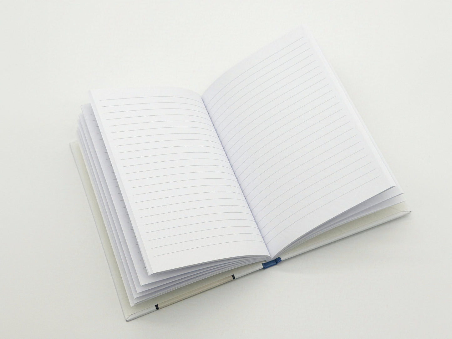 Open notebook with lined pages on a white background