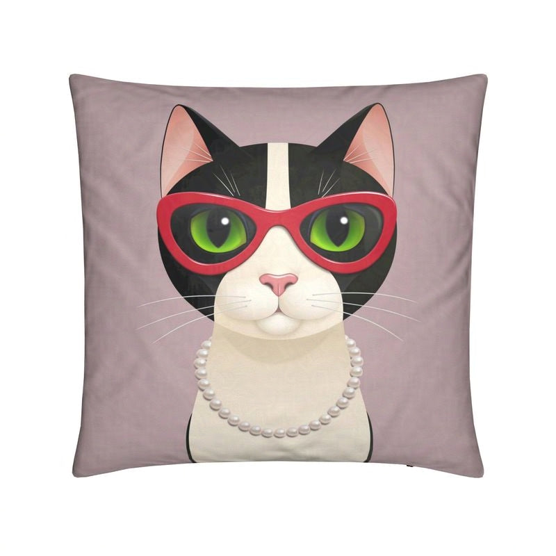 Cushion with Mrs Cat wearing cat eye glasses and pearls, facing forward against a pink background