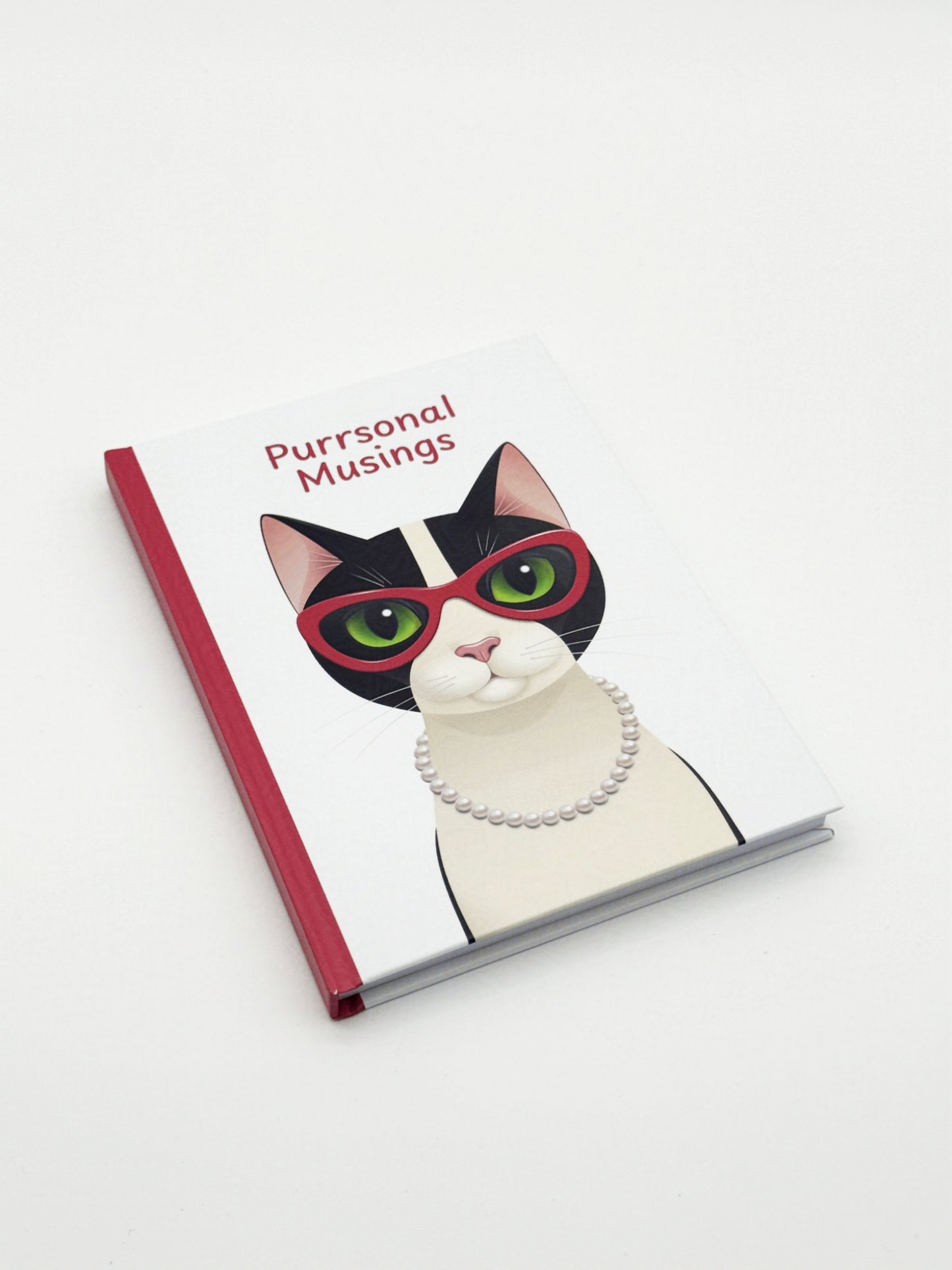 Notebook with a cat illustration and 'Purrsonal Musings' text on a white background