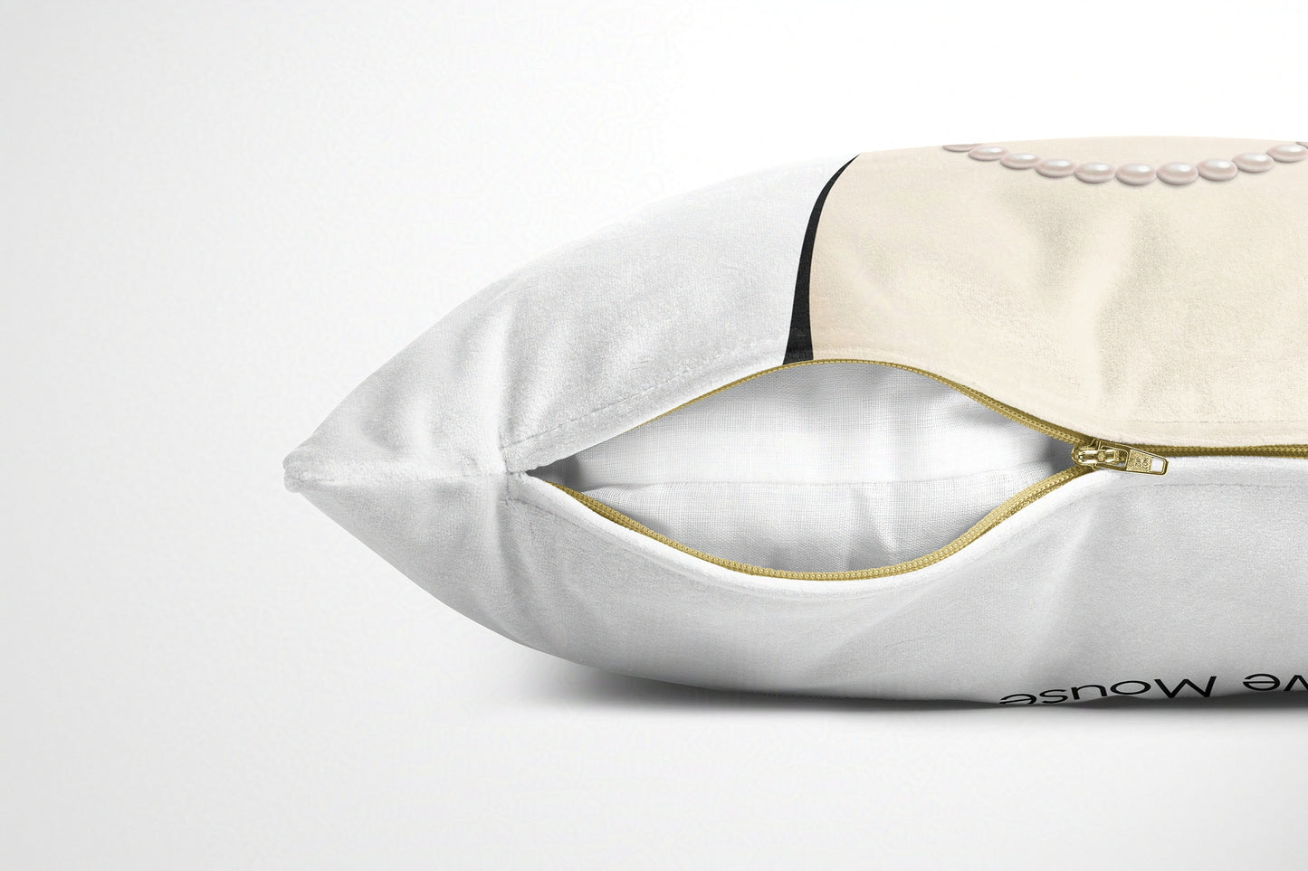 White cushion with gold zipper on a white background