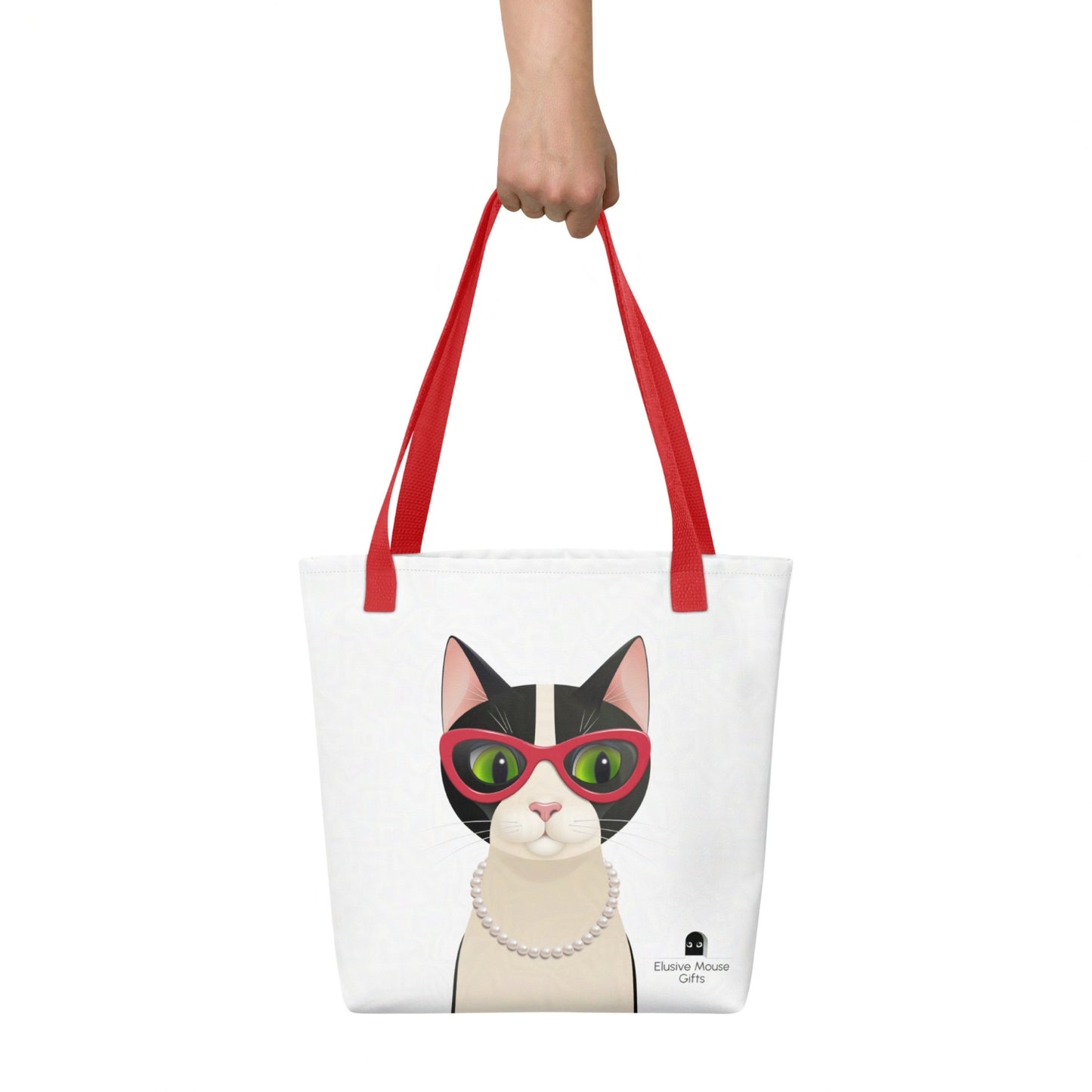 Mrs Cat tote bag shown being held by hand, with the full cat design clearly displayed against a white background