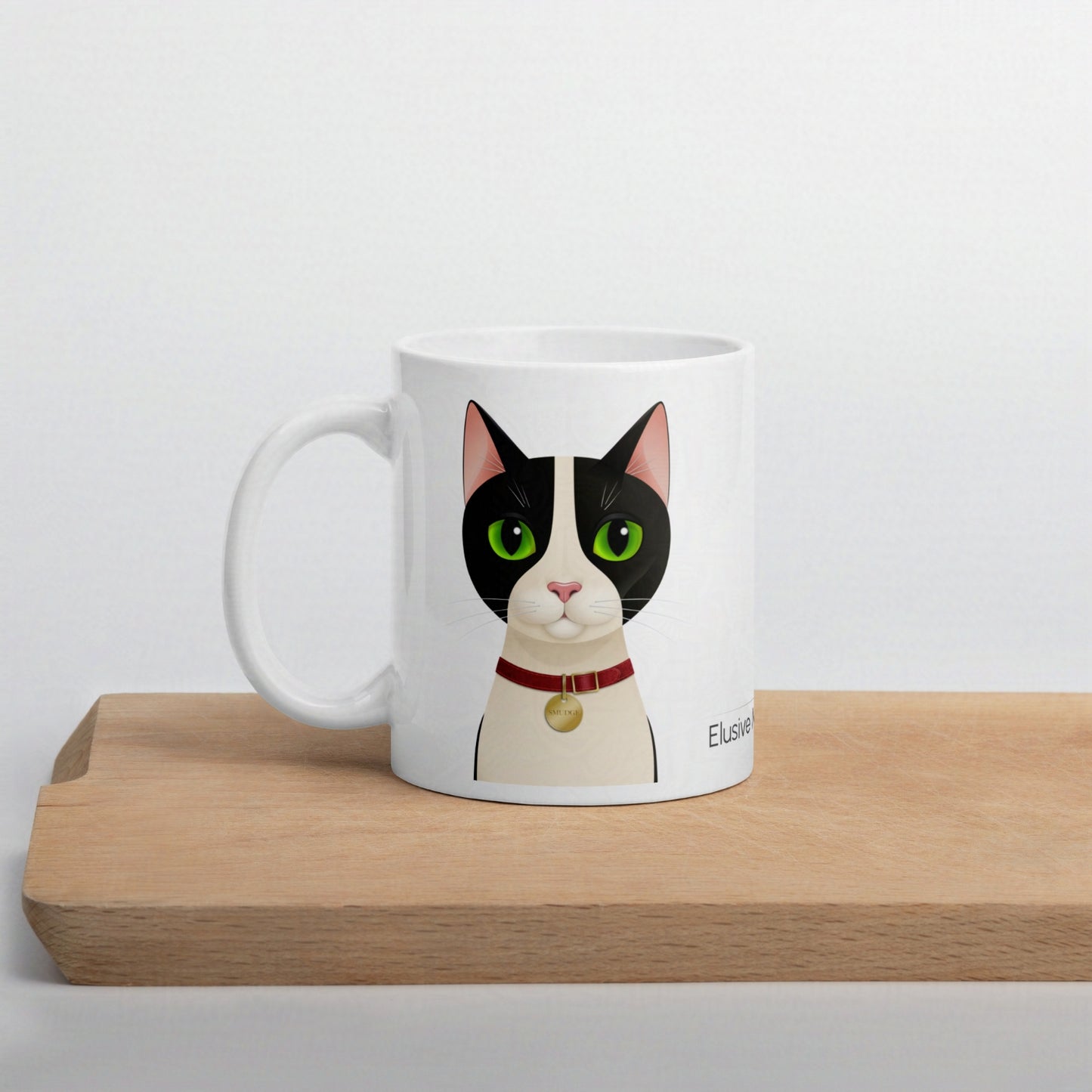 Smudge 11oz mug resting on a wooden chopping board against a plain background, highlighting the design and shape