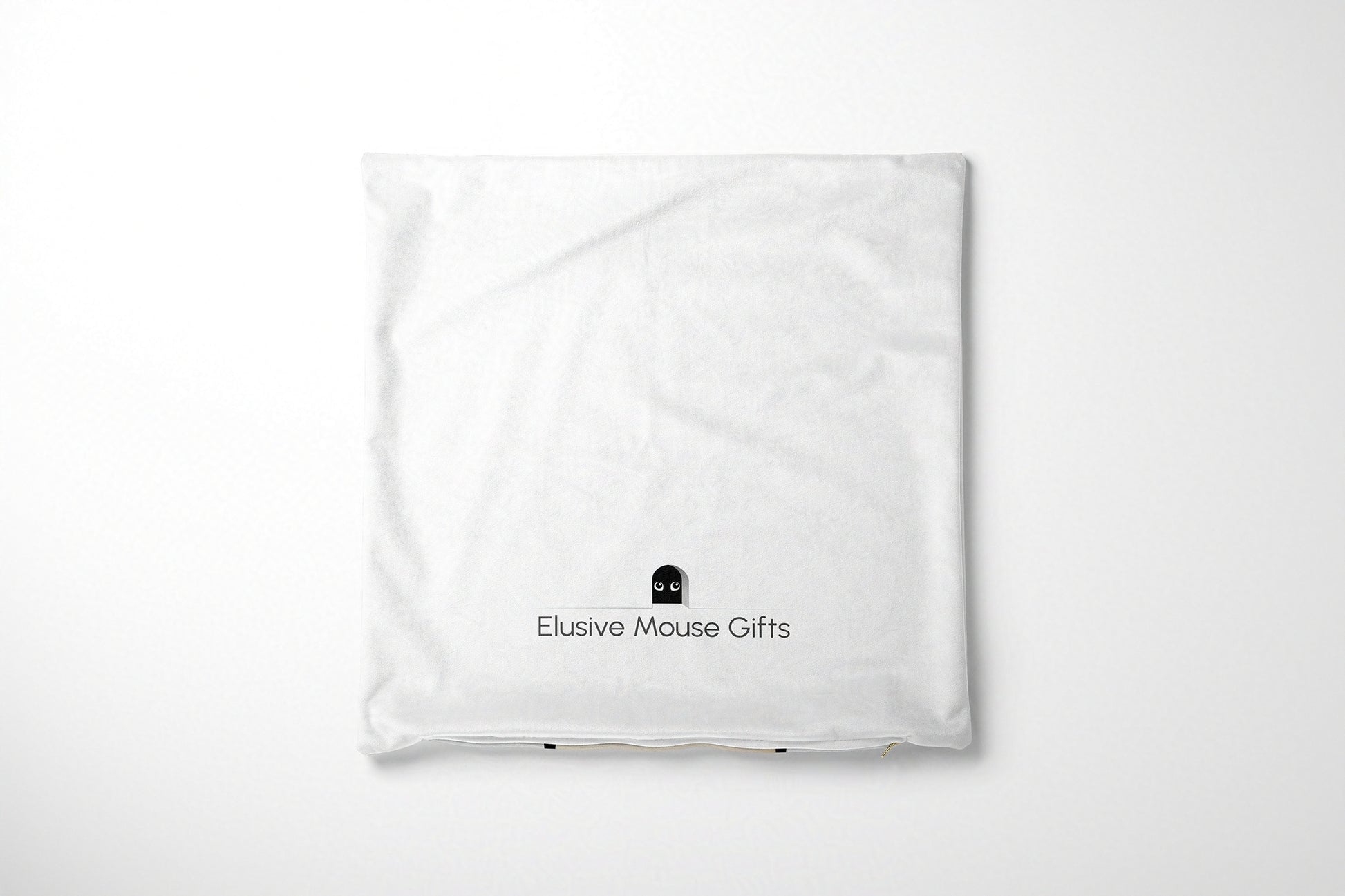 White cushion cover with 'Elusive Mouse Gifts' logo on a white background