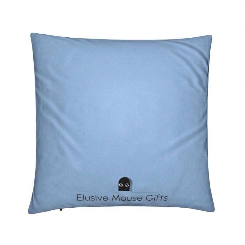 Reverse of Freddie cushion showing a small mouse in a mousehole on a blue background