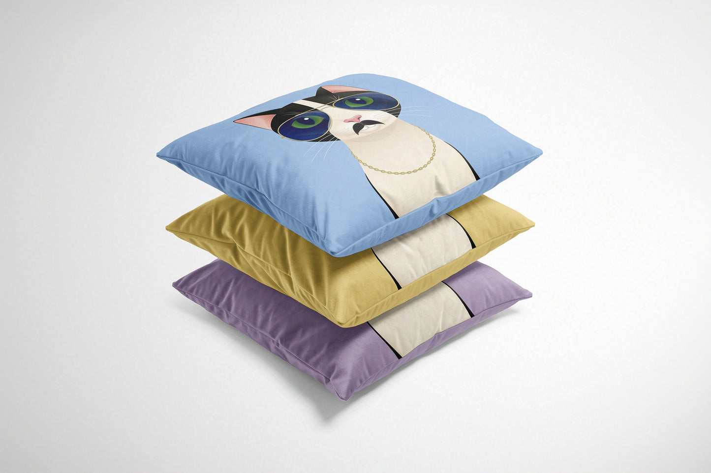 Stack of three decorative cushions with cartoon cat design on a white background