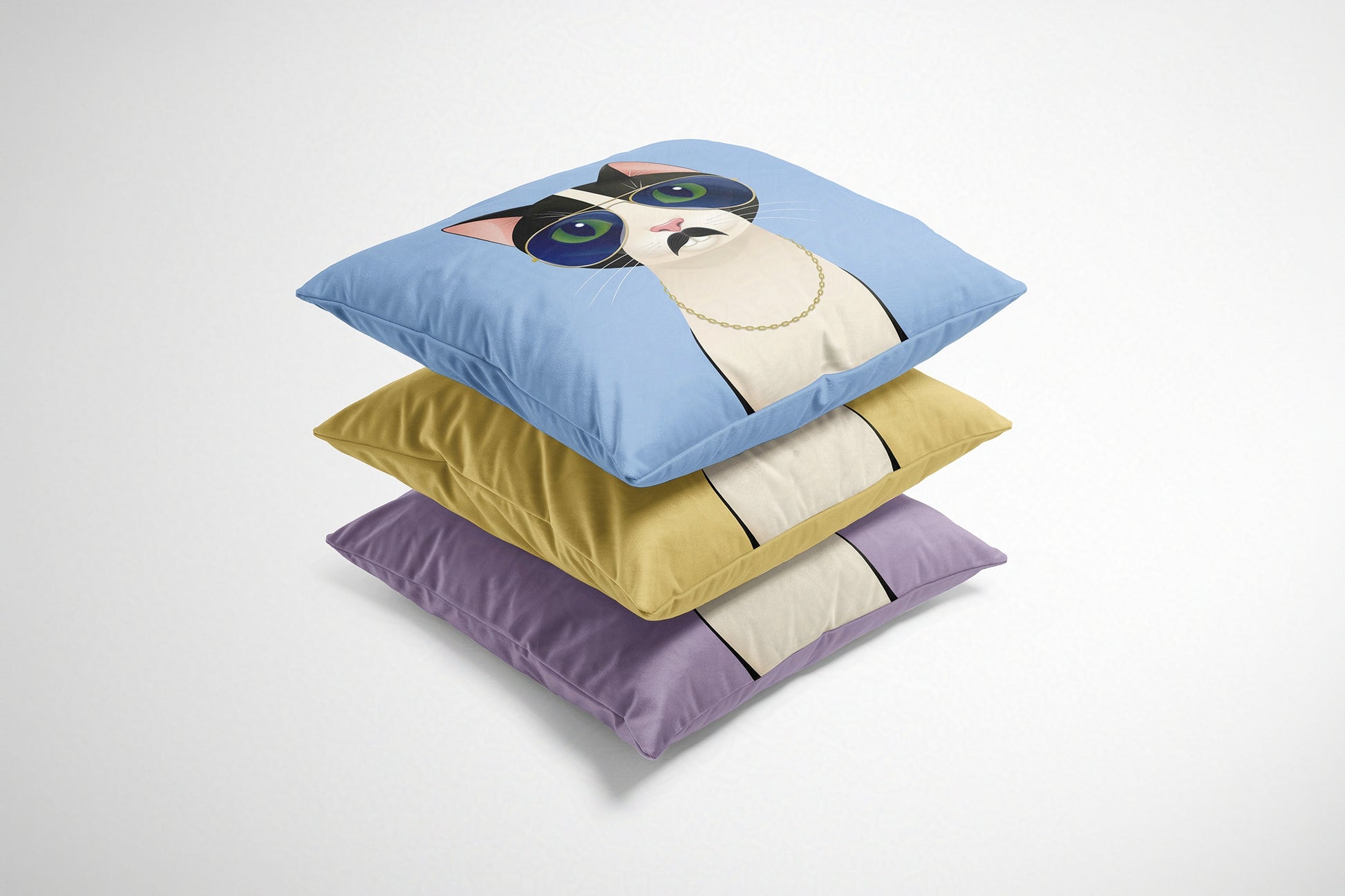 Stack of three decorative cushions with cartoon cat design on a white background