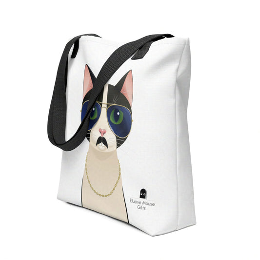Tote bag with Freddie the tuxedo cat wearing aviator sunglasses, fake moustache, and gold chain, shown from a 3/4 angle on a white background