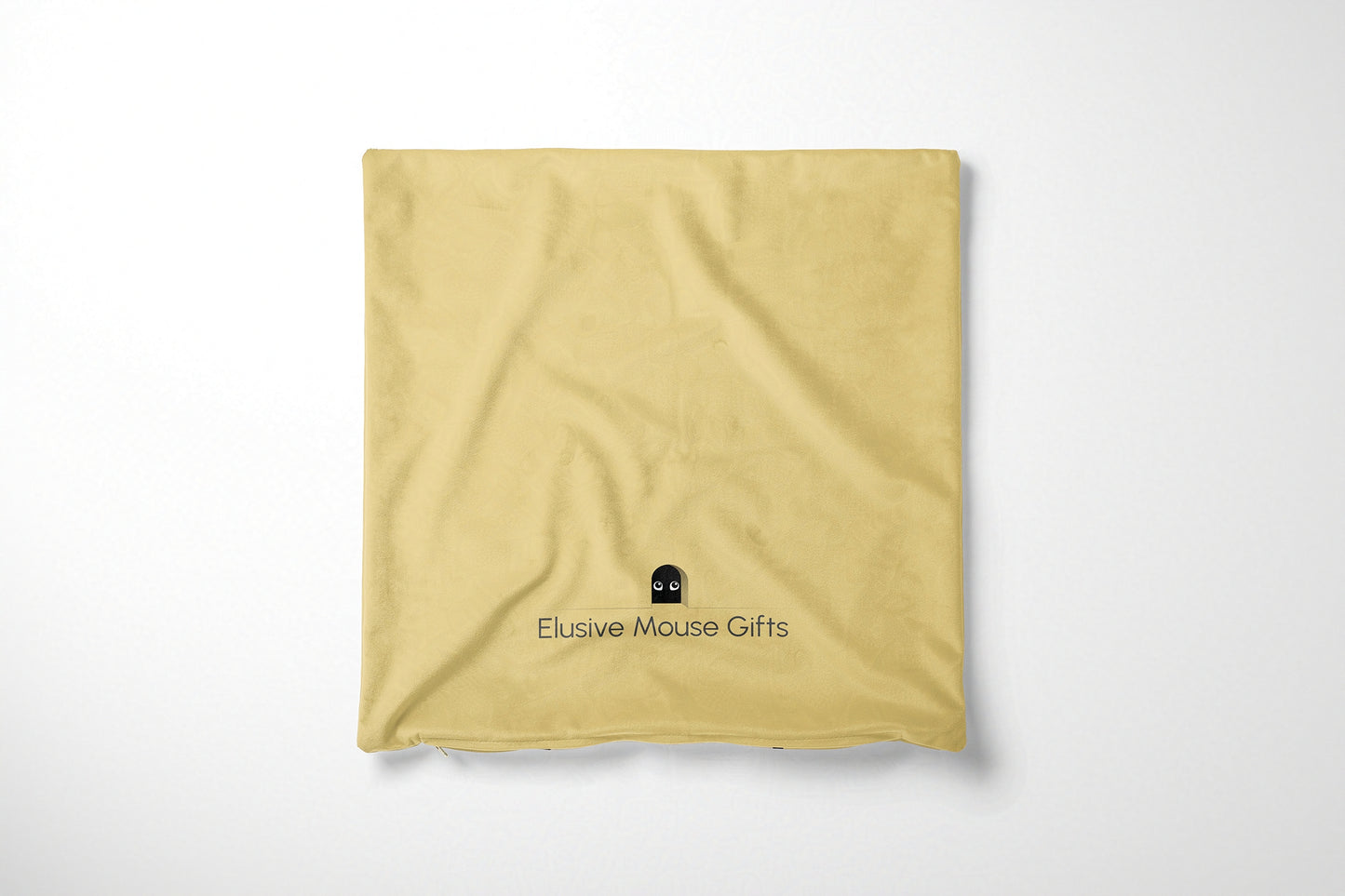 Yellow cushion cover back with 'Elusive Mouse Gifts' logo on a white background
