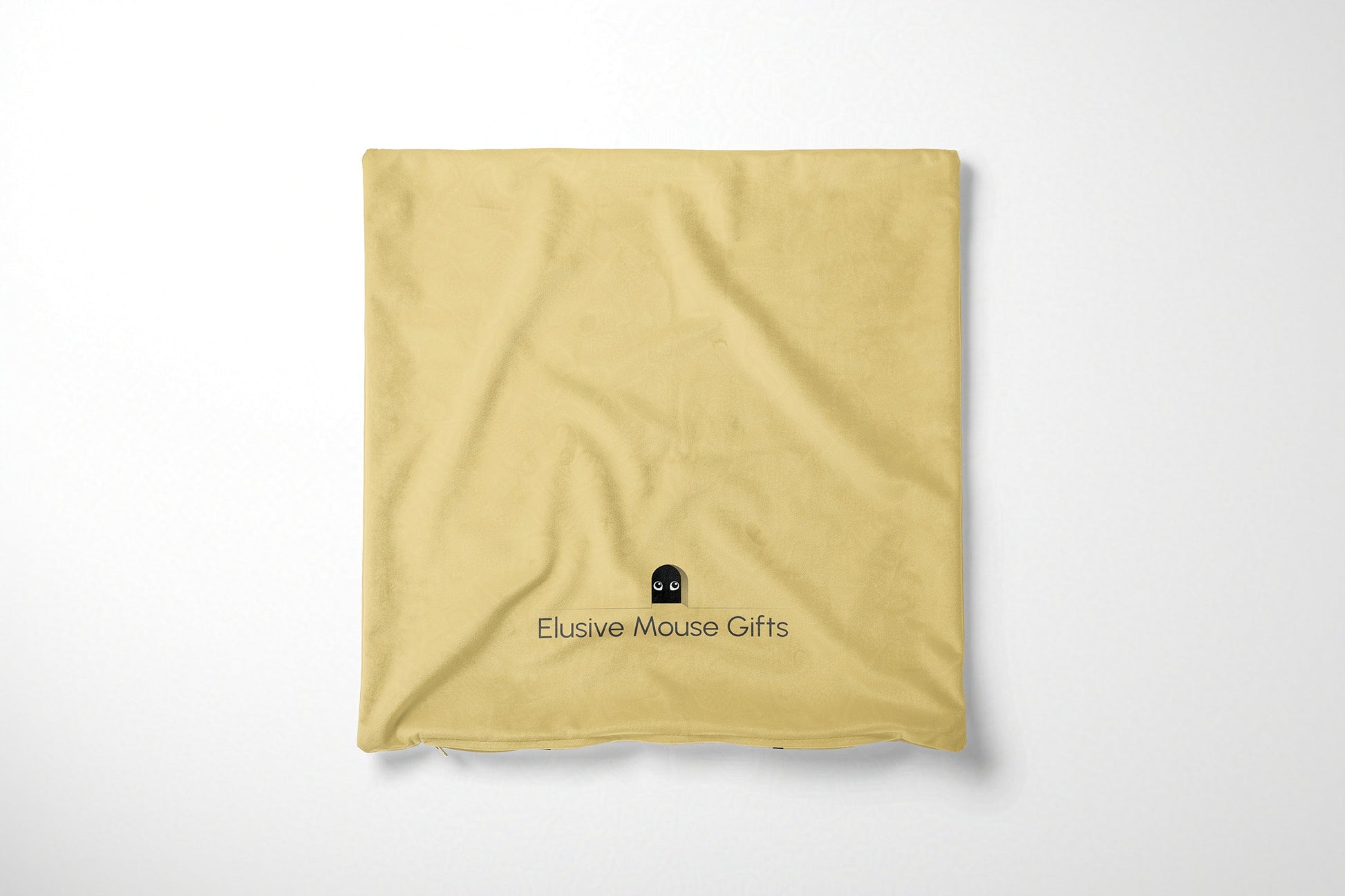 Yellow cushion cover back with 'Elusive Mouse Gifts' logo on a white background