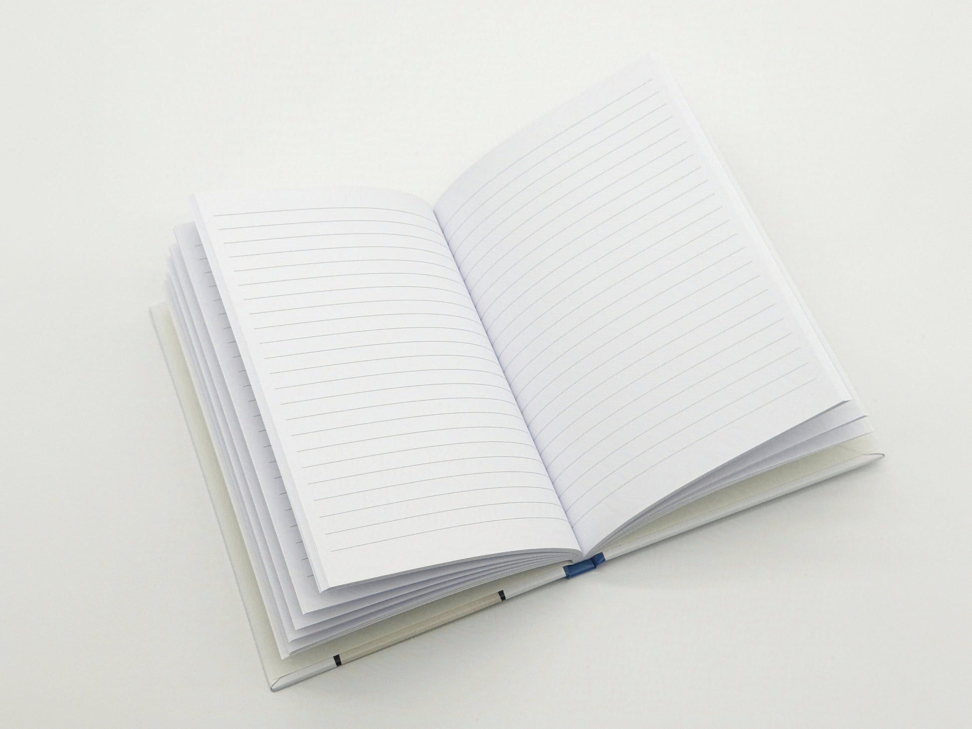 Open notebook with lined pages on a white background