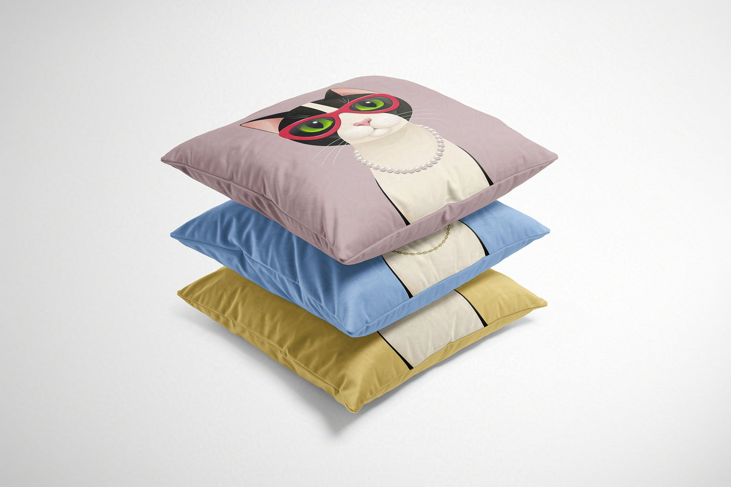 Stack of three colourful cushions with cartoon cats on a white background