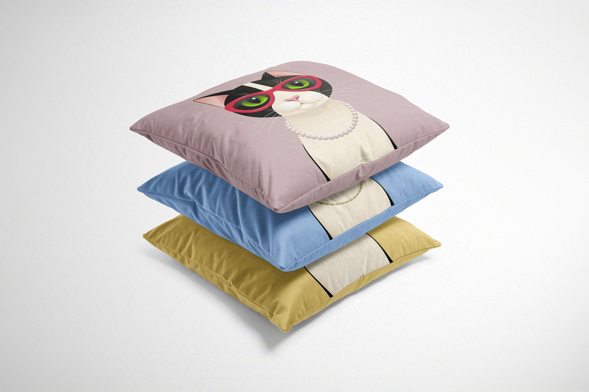 Stack of three colourful cushions with cartoon cats on a white background