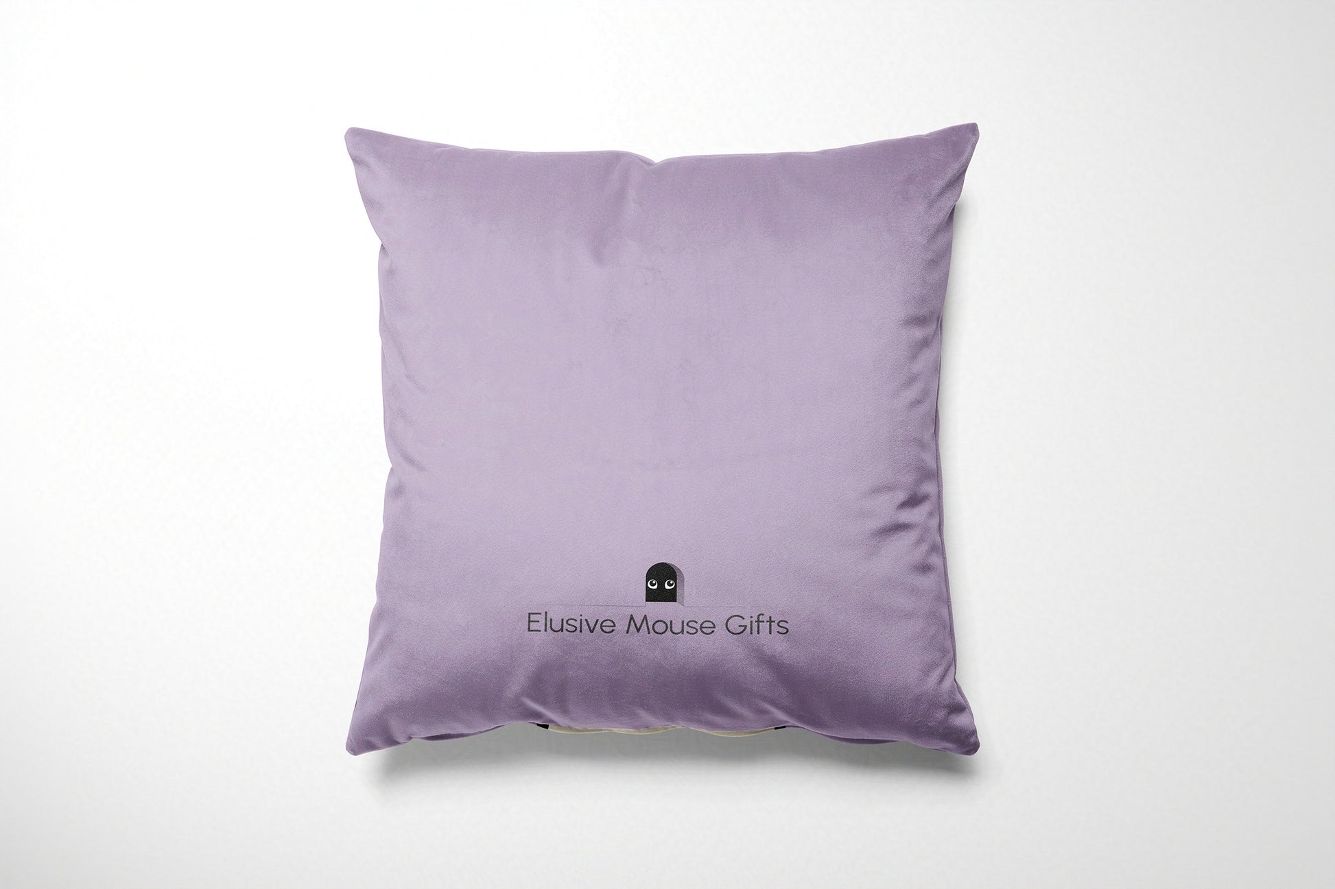 Lavender pillow with 'Elusive Mouse Gifts' logo on a white background