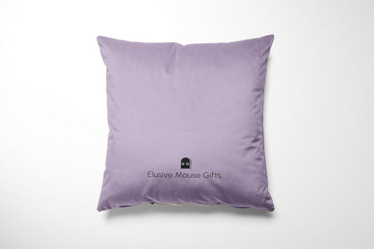 Lavender pillow with 'Elusive Mouse Gifts' logo on a white background