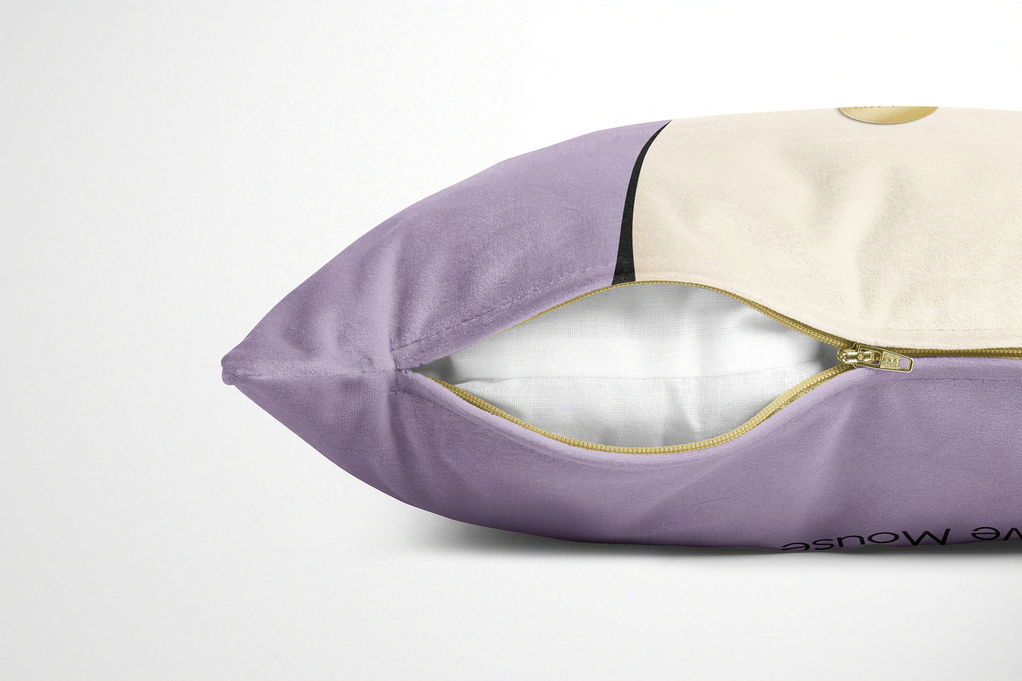 Pink coloured cushion with gold zipper on a white background
