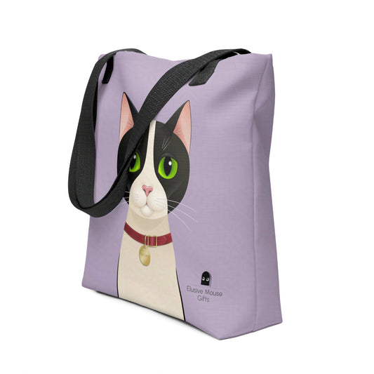 Tote bag with Smudge the tuxedo cat facing forward, shown from a three-quarter angle against a lavender background